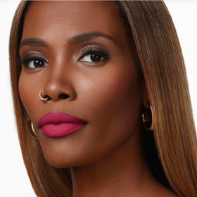 The Lip Bar open cap revealing creamy tip and glide for precise strokes