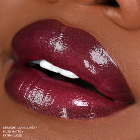 The Lip Bar Muse next to a coin to show .24 fl oz travel-friendly size and portability