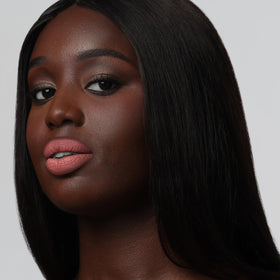 The Lip Bar texture swatch on arm showing pigment payoff benefit: visible true color