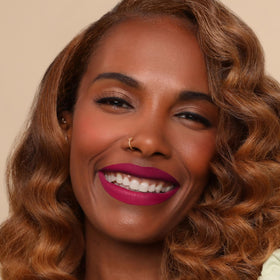 The Lip Bar worn by a model in a lifestyle setting showcasing confident long wear