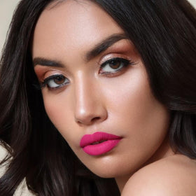 Lifestyle shot of The Lip Bar on model in city outfit for everyday bold look