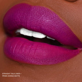 The Lip Bar Prima Donna tucked inside a makeup bag illustrating portability and style