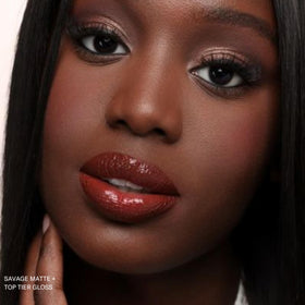 The Lip Bar Savage ingredient label highlighting jojoba oil and vitamin E benefits