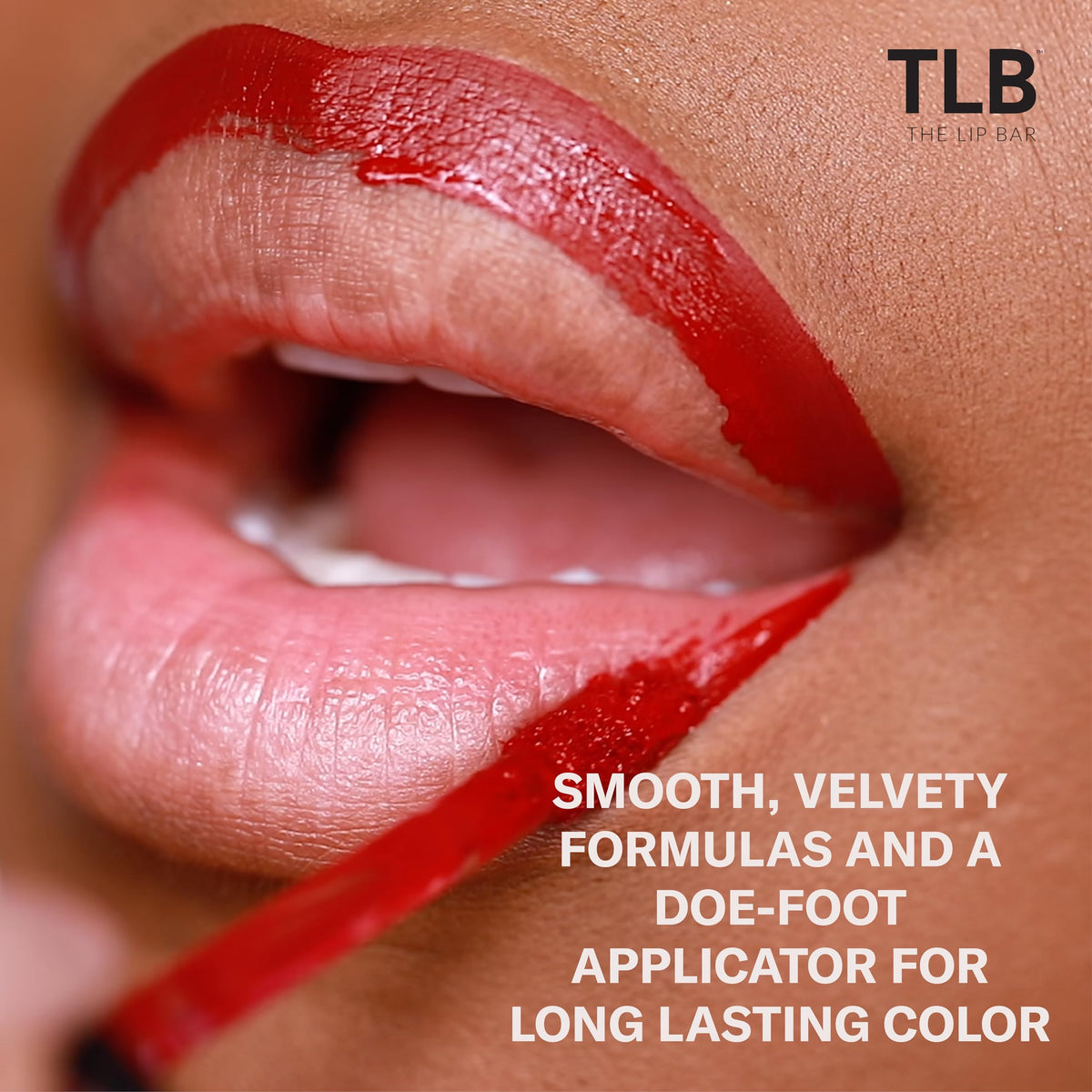 The Lip Bar Bawse Lady swatch on skin showing saturated blue-red payoff