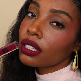 The Lip Bar Muse and Rebel swatches on arm showing true color payoff benefit