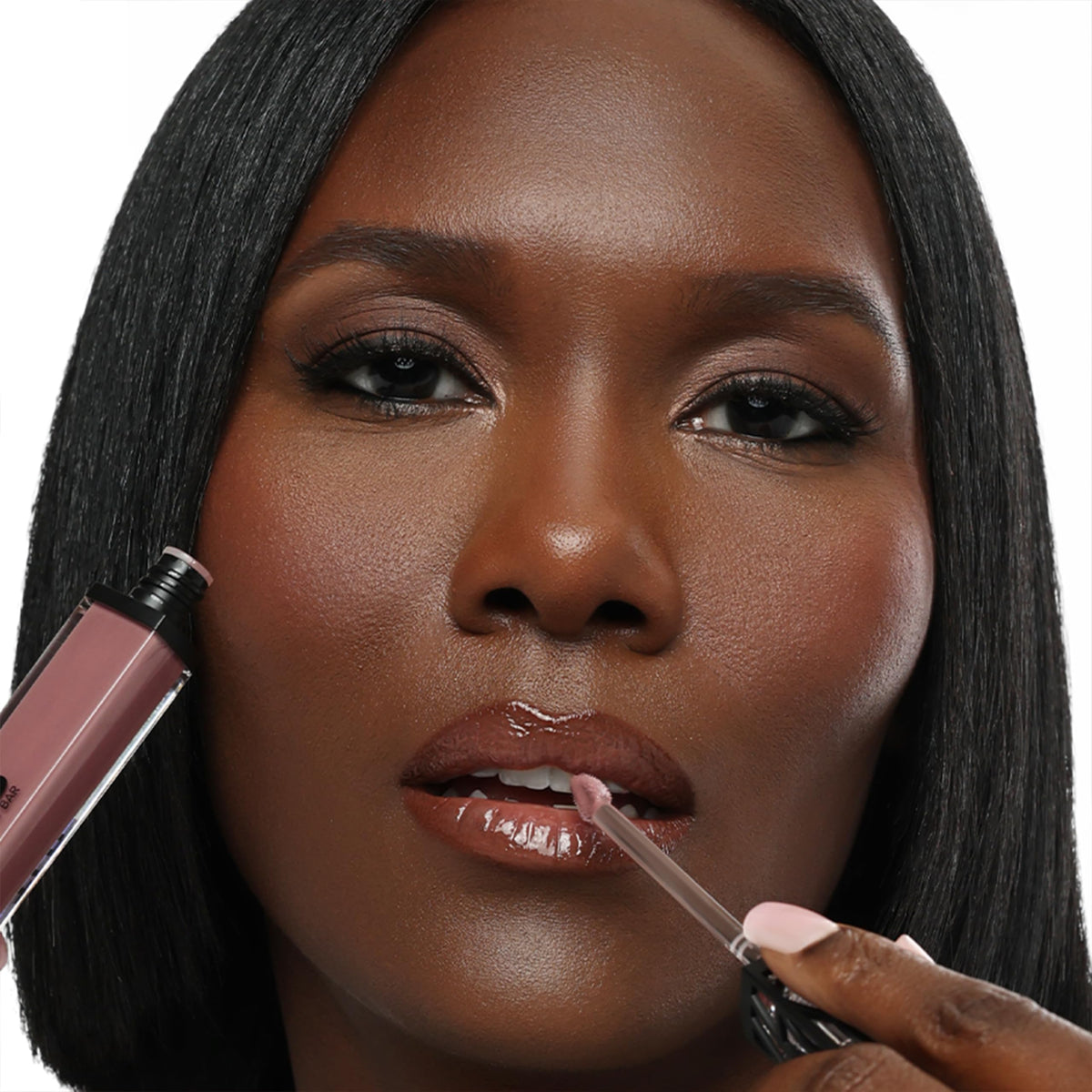The Lip Bar gloss texture close-up with champagne shimmer showing luminous finish