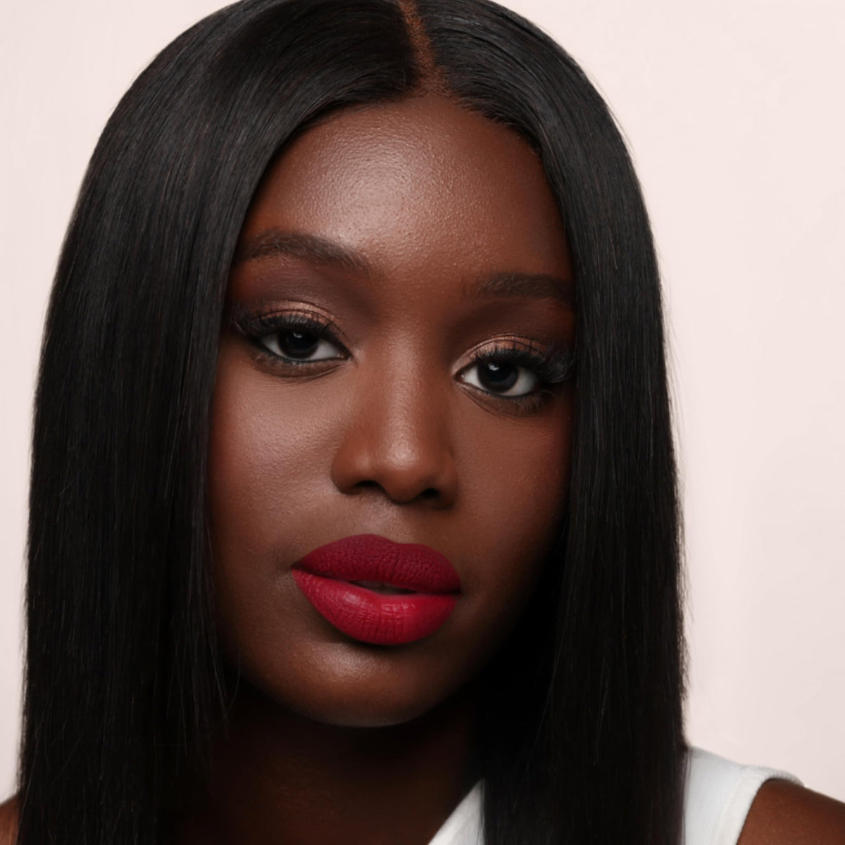 The Lip Bar texture shot showing glossy glide drying to velvety matte comfort