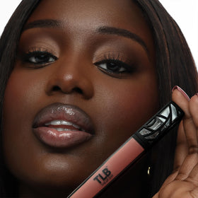 Close-up of The Lip Bar gloss texture highlighting shimmer and non-sticky finish
