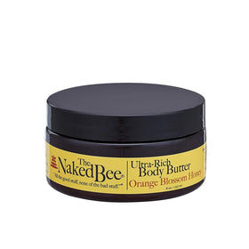 The Naked Bee front jar shot showing product branding and orange blossom honey scent benefit