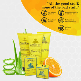 The Naked Bee ingredients flatlay with shea, cocoa butter, and sunflower oil for natural conditioning