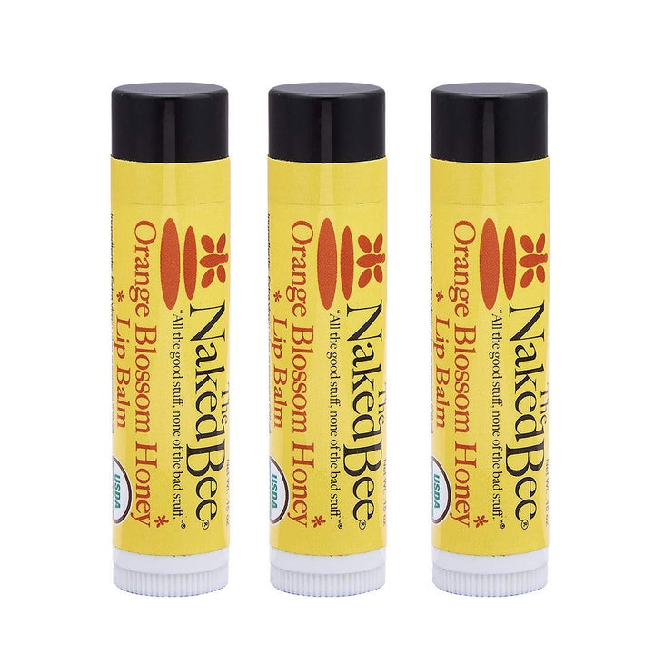 The Naked Bee front packaging showing three orange blossom honey lip balms and travel convenience