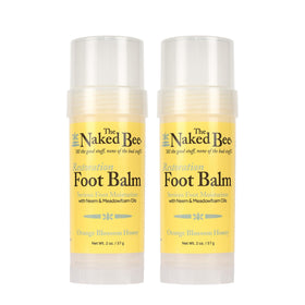The Naked Bee front packaging showing two 2 oz balms and easy application benefit