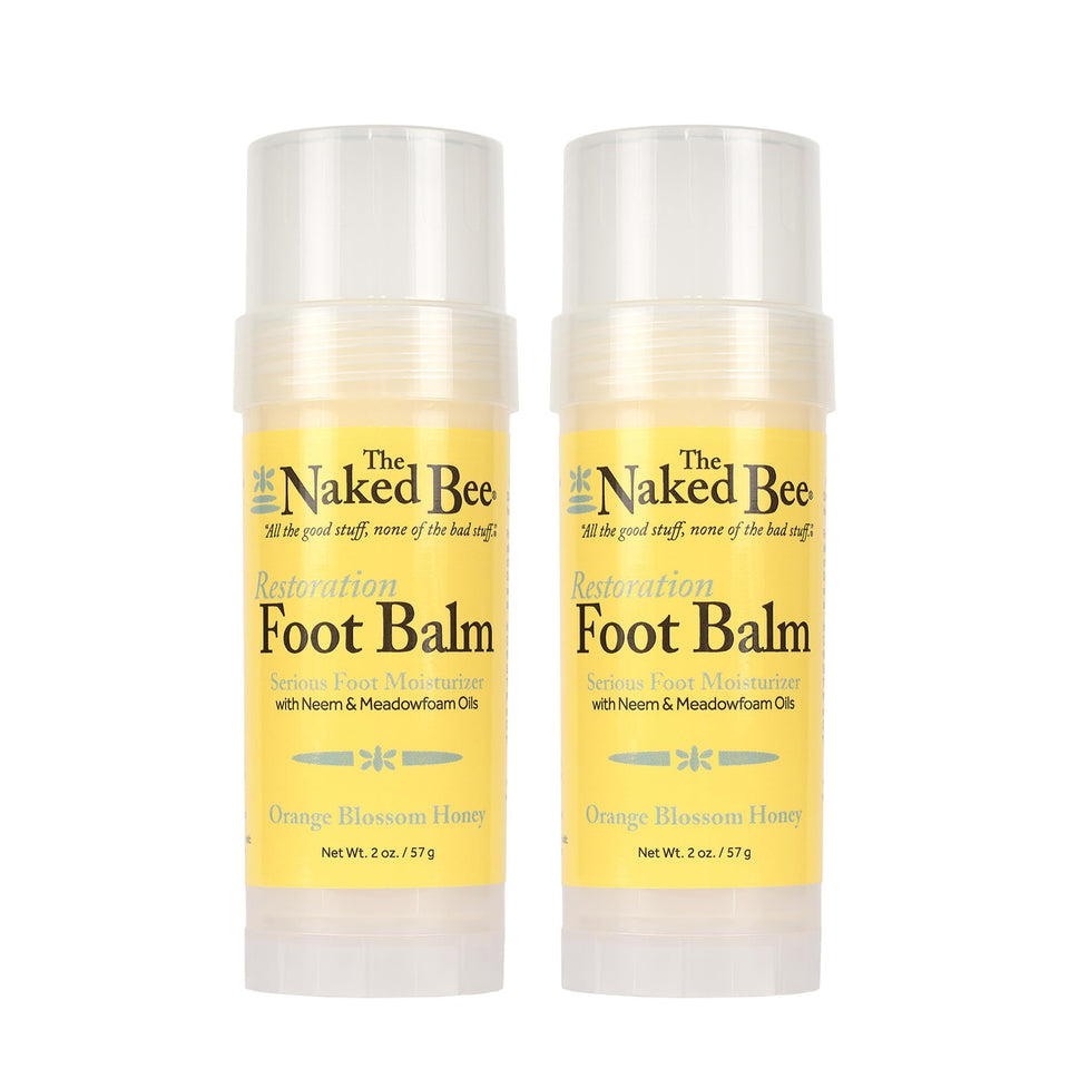 The Naked Bee front packaging showing two 2 oz balms and easy application benefit