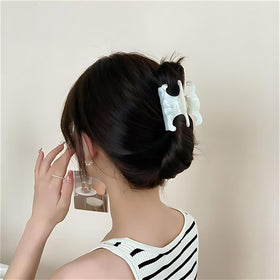 The Only One clips worn in half-up hairstyle demonstrating stable grip and neat look