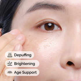 The Ordinary being applied to eye contour, demonstrating gentle patting for reduced puffiness