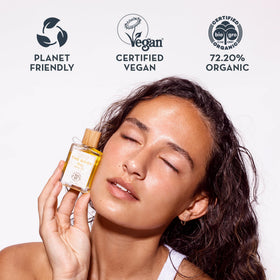 The Organic Skin Co. bottle in hand to show 30mL size and travel-friendly convenience benefit