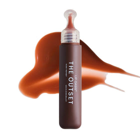 The Outset lip oasis front packaging showing bottle and glossy finish benefit