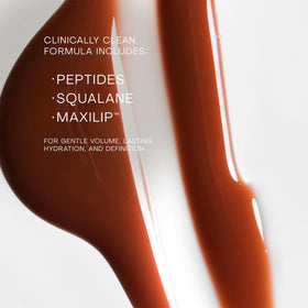 The Outset lip oasis next to coin to show 0.3 oz size and travel-friendly benefit
