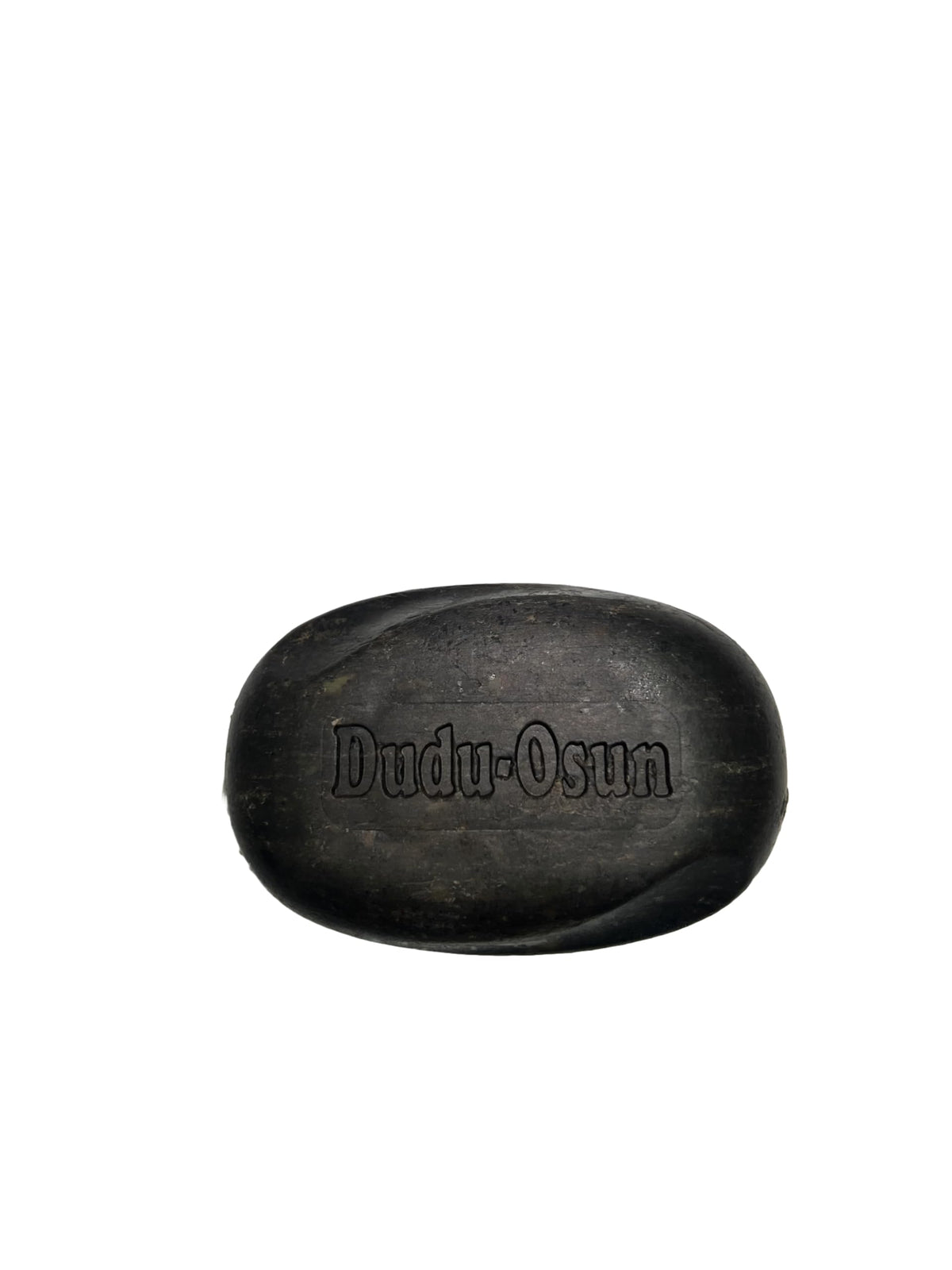 The Roots Naturelle close-up of black soap texture highlighting natural ingredient appeal