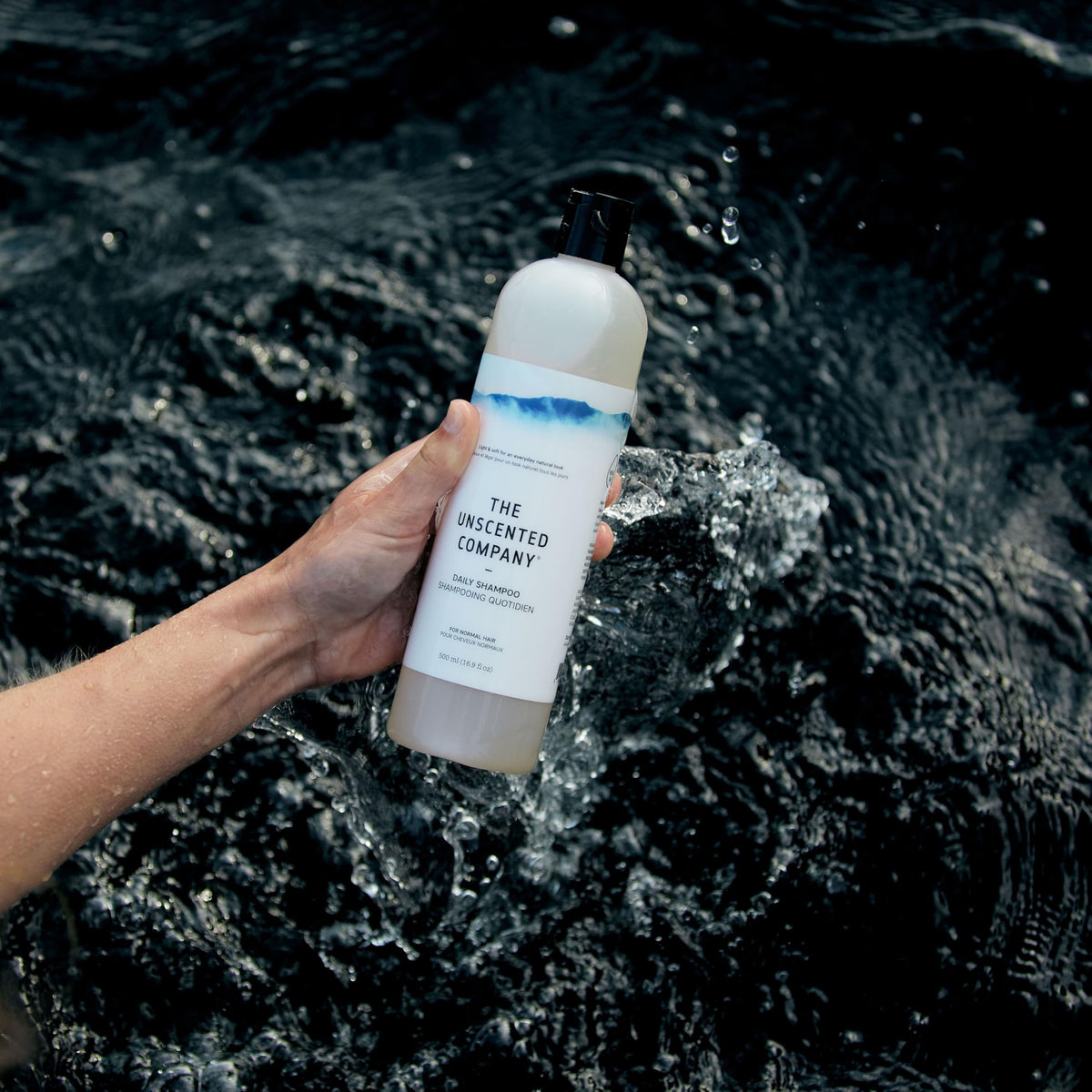 16.9 fl oz bottle next to refill pouch showing The Unscented Company eco-friendly option