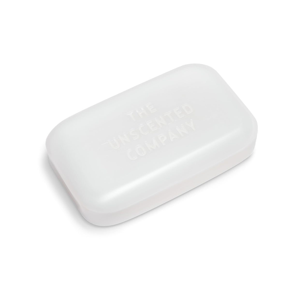 Hand holding a single The Unscented Company soap bar to show size and easy grip for bathing