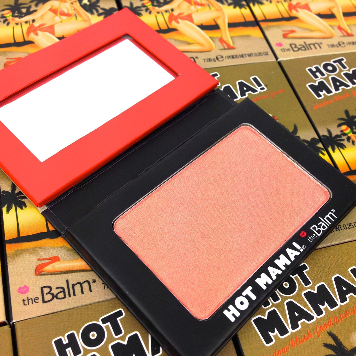 theBalm brush applying blush to cheek for fast, even color build
