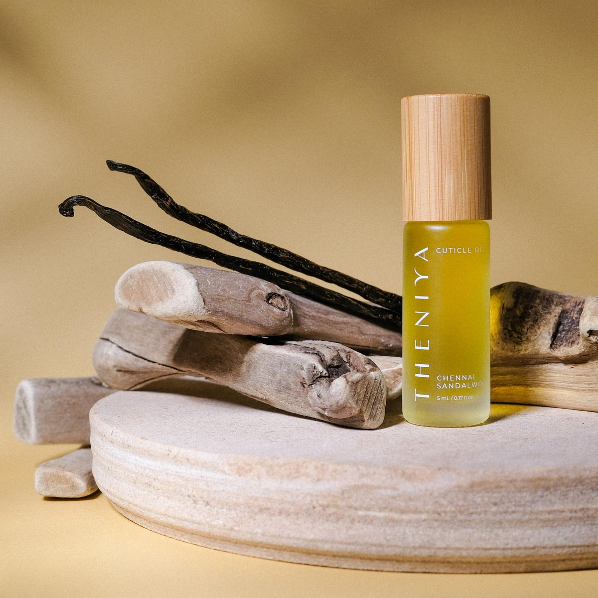 Theniya glass bottle with bamboo cap presents eco-friendly packaging and elegant look