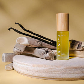 Theniya glass bottle with bamboo cap presents eco-friendly packaging and elegant look