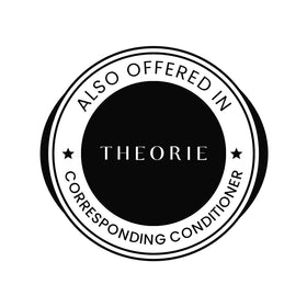 Person lathering Theorie shampoo in shower illustrating gentle cleansing and improved manageability