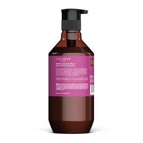 Close-up of Theorie label and ingredient list highlighting helichrysum and plum seed oil benefits