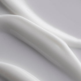 Three Ships cream texture droplet demonstrating lightweight absorption