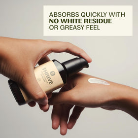 Thrive Natural Care cream texture closeup demonstrating lightweight spreadability