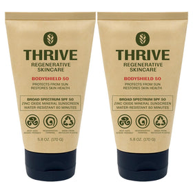 Thrive Natural Care front packaging showing SPF50 and reef-safe benefits