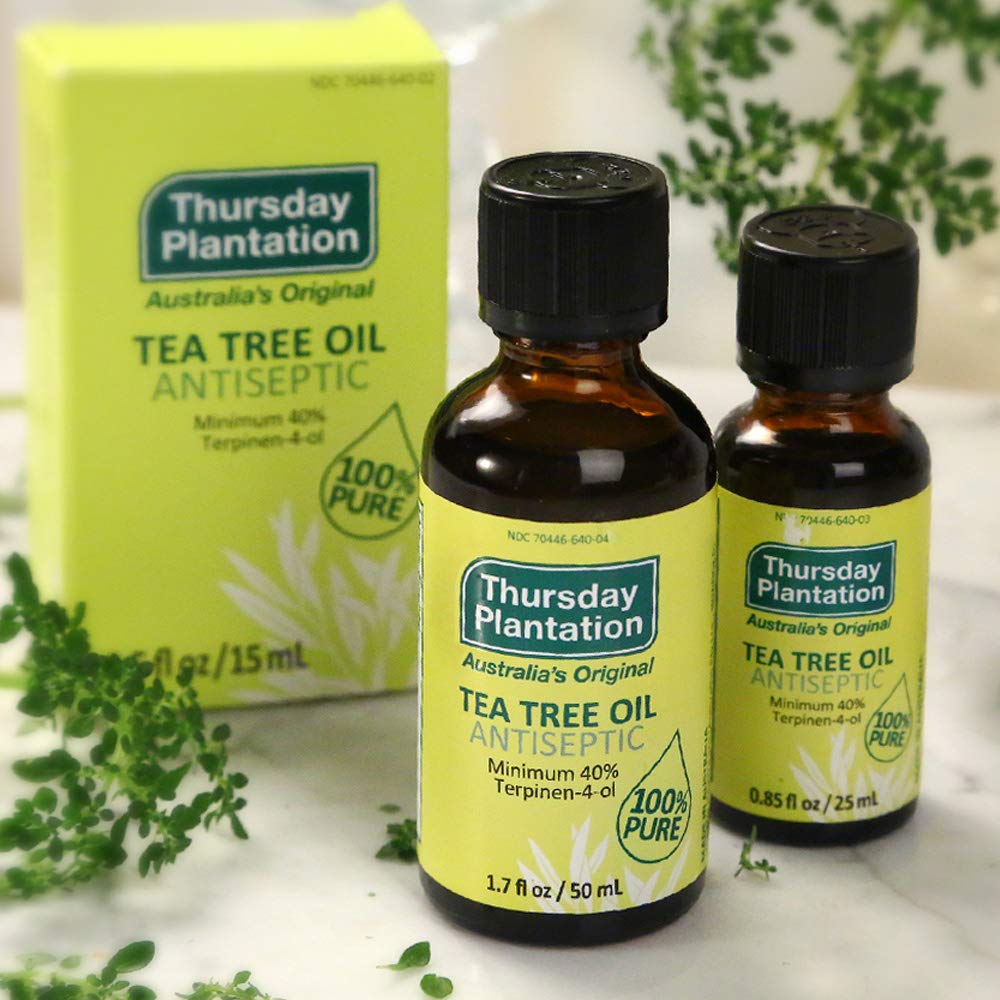 Thursday Plantation bottle in hand showing 50ml scale for portable convenience