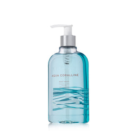 Thymes front packaging shows Aqua Coralline bottle and clear branding for shelf appeal