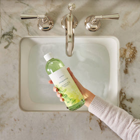 Thymes refill being poured into pump dispenser for easy refill benefit