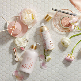Thymes bottle beside gardenia and rose showing fragrance inspiration benefit