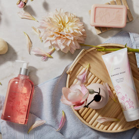 Thymes Kimono Rose beside a ruler for 6 oz size and travel-friendly convenience