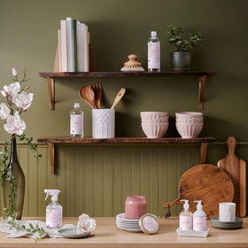 Thymes lotion bottle with magnolia blossoms suggesting fresh floral aroma