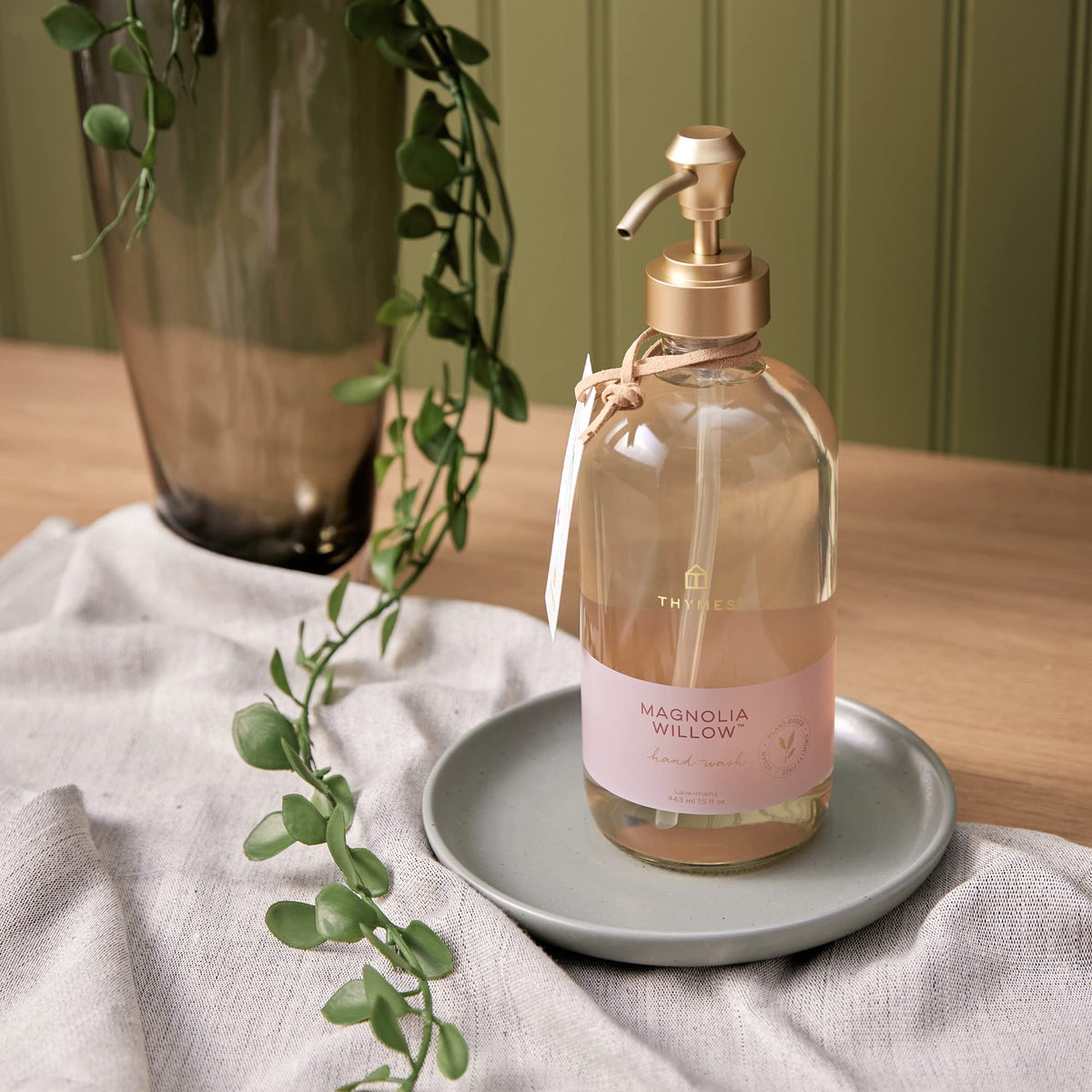 Thymes bottle styled on bathroom counter creating inviting sink ambiance benefit