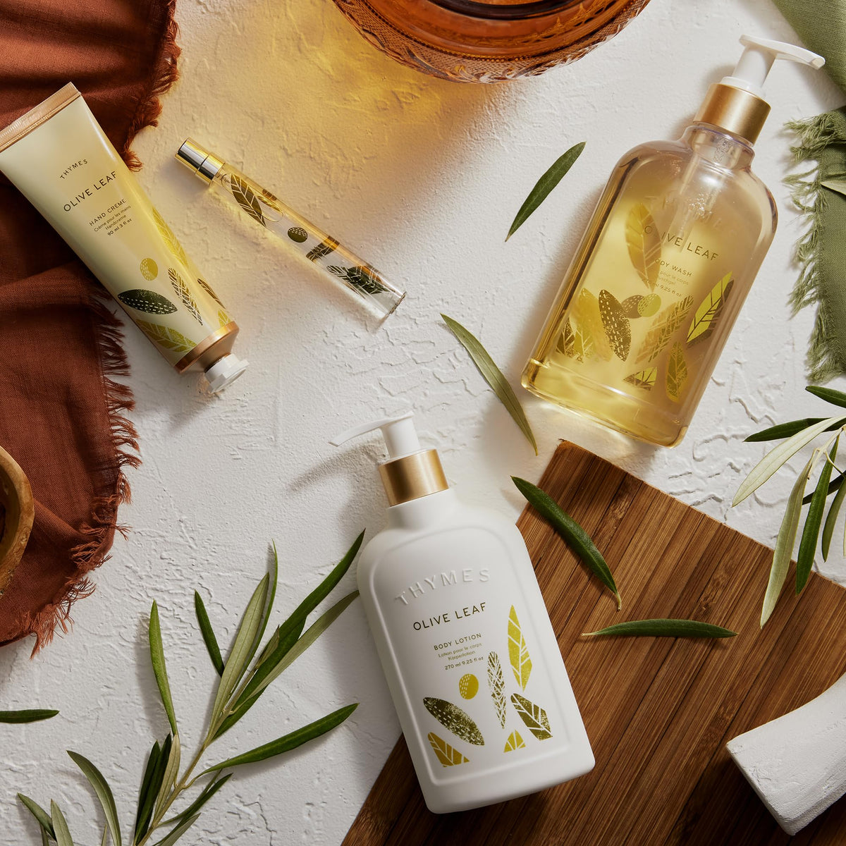Thymes pouring body wash into hand demonstrating rich lather and cleansing benefit