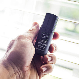 Tiege Hanley applying eye cream under-eye area demonstrating reduced puffiness benefit
