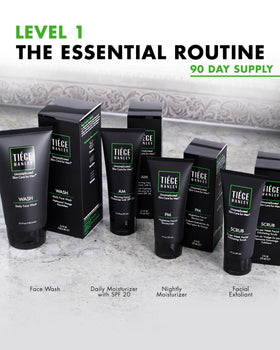Tiege Hanley exfoliating scrub texture on fingers showing fine particles to refresh skin