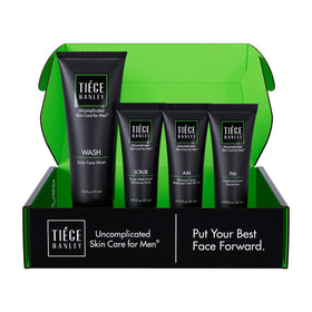 Tiege Hanley front packaging of four-piece essential routine showing kit benefit