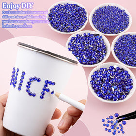 TINKRSTUFF hand holding mixed 2–6mm royal blue rhinestones showing scale and size variety for detailed work