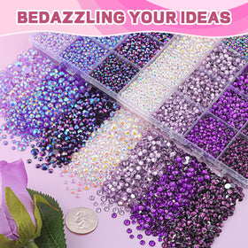 TINKRSTUFF hand holding mixed-size gems to show scale and generous quantity