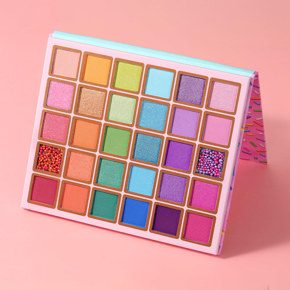 Tintark model wearing colorful eye look demonstrating palette versatility for day-to-night style