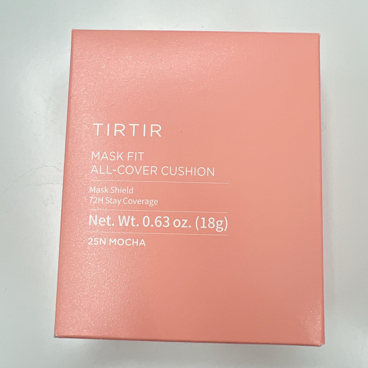 TIRTIR compact next to hand to show size and portability for on-the-go touch ups