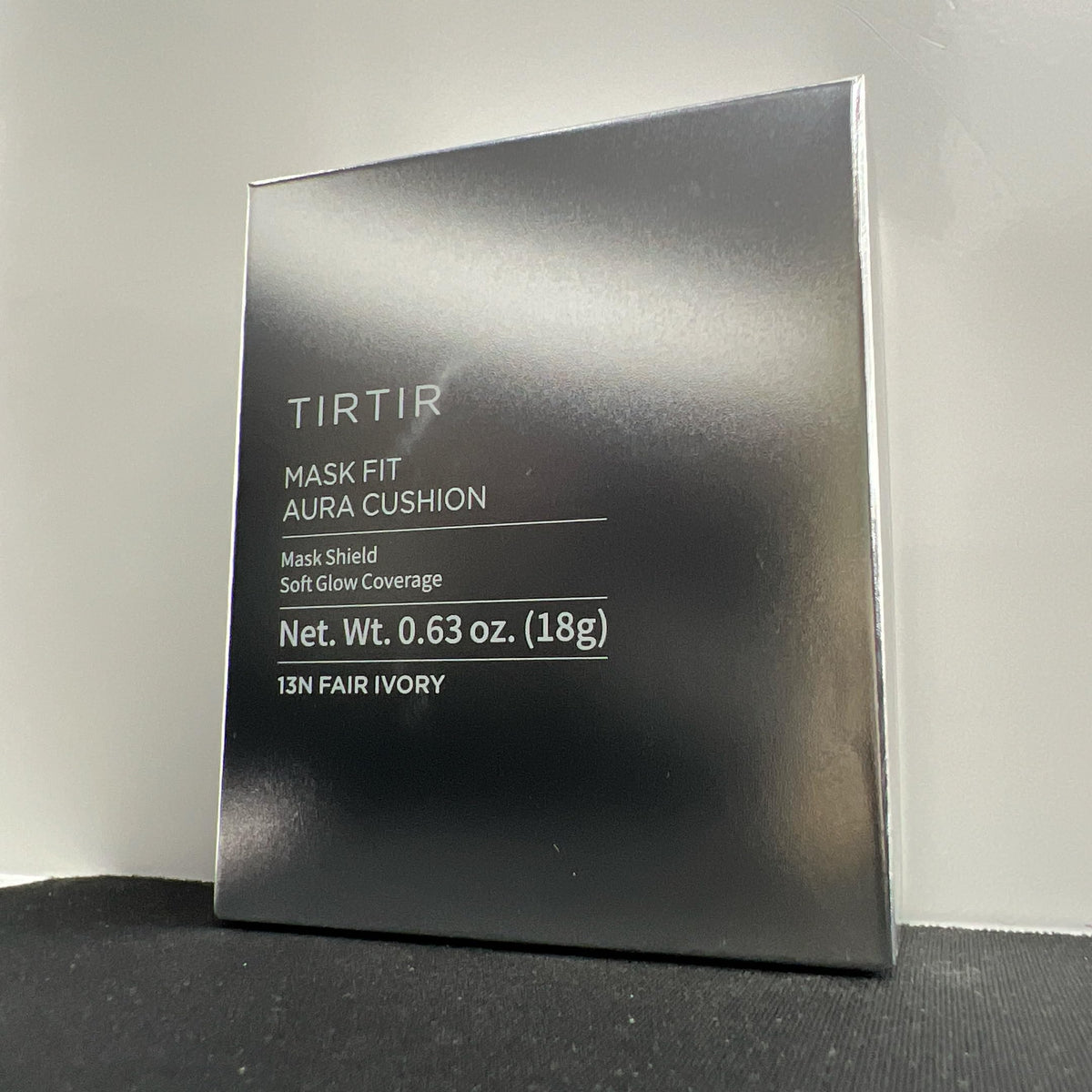 TIRTIR compact in hand showing size scale and portability advantage