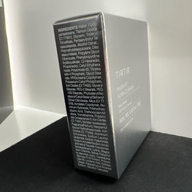 TIRTIR compact beside coin for size comparison and portability